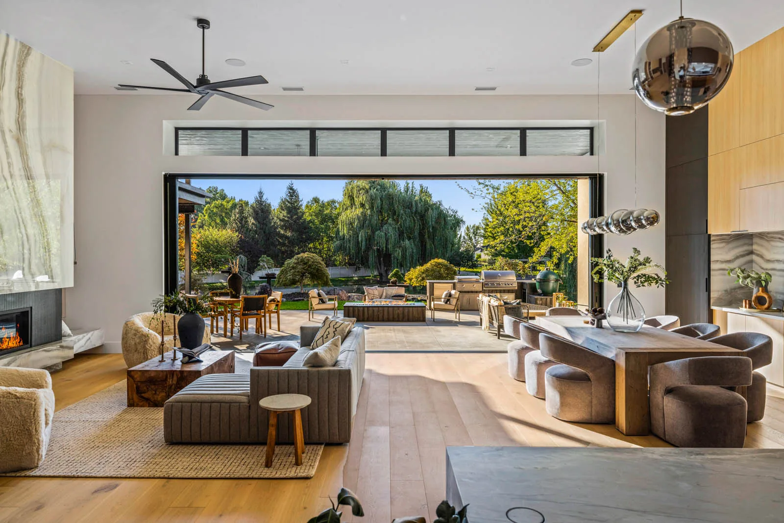 A finished great room opening onto a landscaped yard