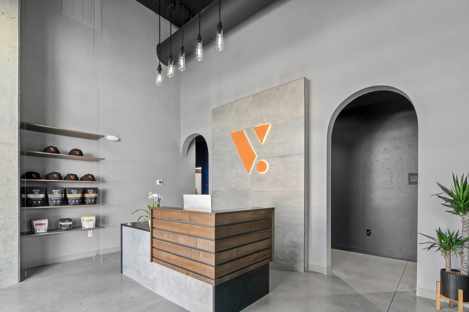 A finished commercial lobby with concrete and wood millwork