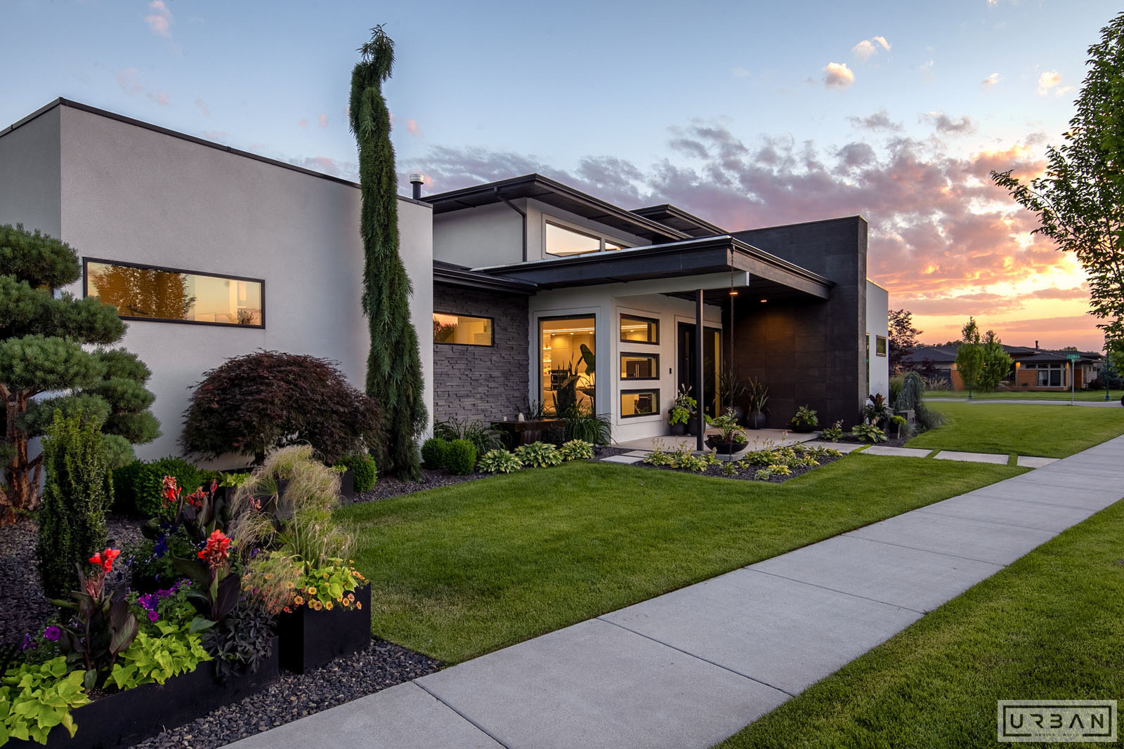 A modern custom home exterior at dusk