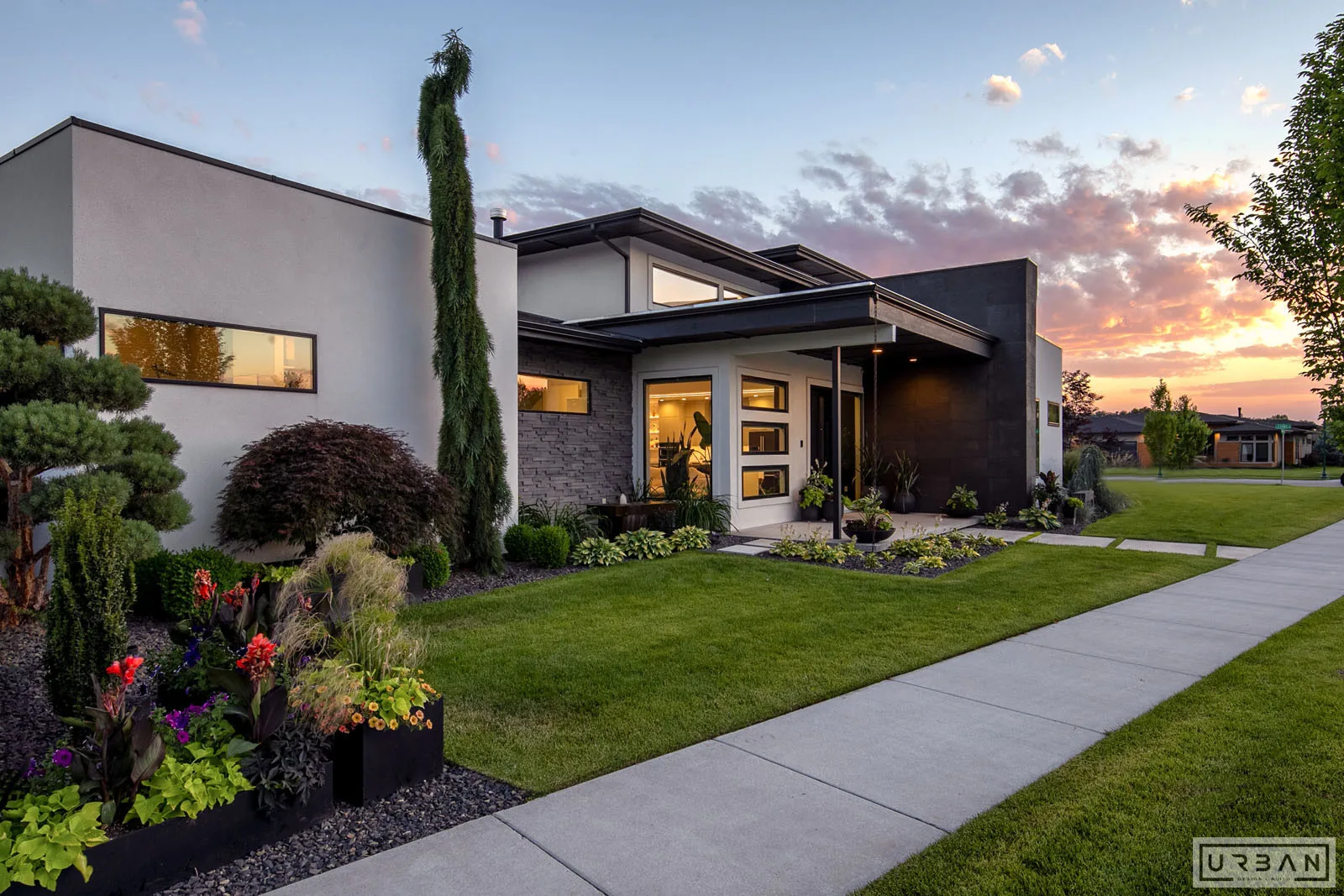 A modern custom home exterior at dusk